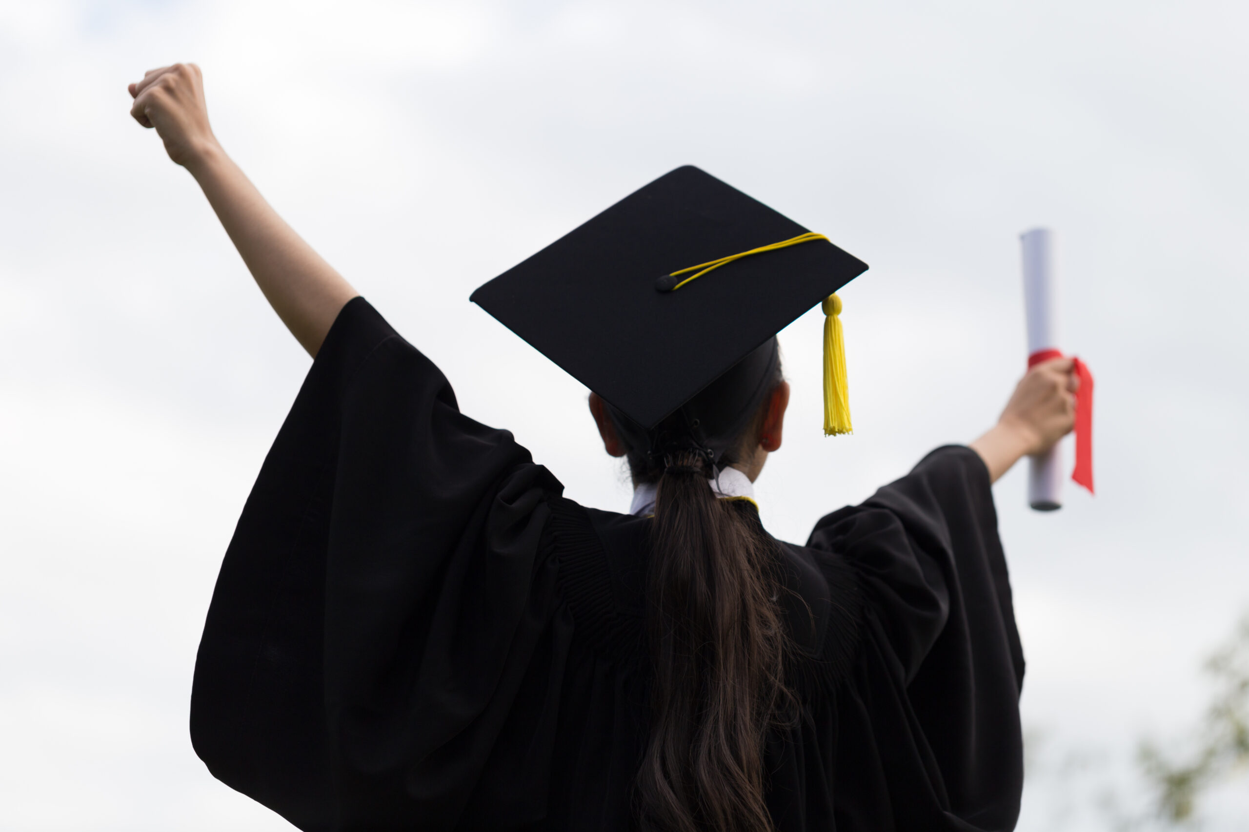 new graduate celebrating